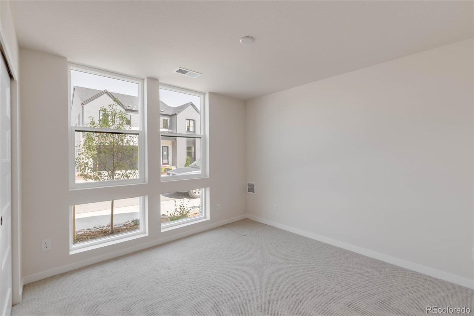 11468 Alla Breve Lone Tree, CO 80134 - Photo 5 of 34 an empty room with a large window