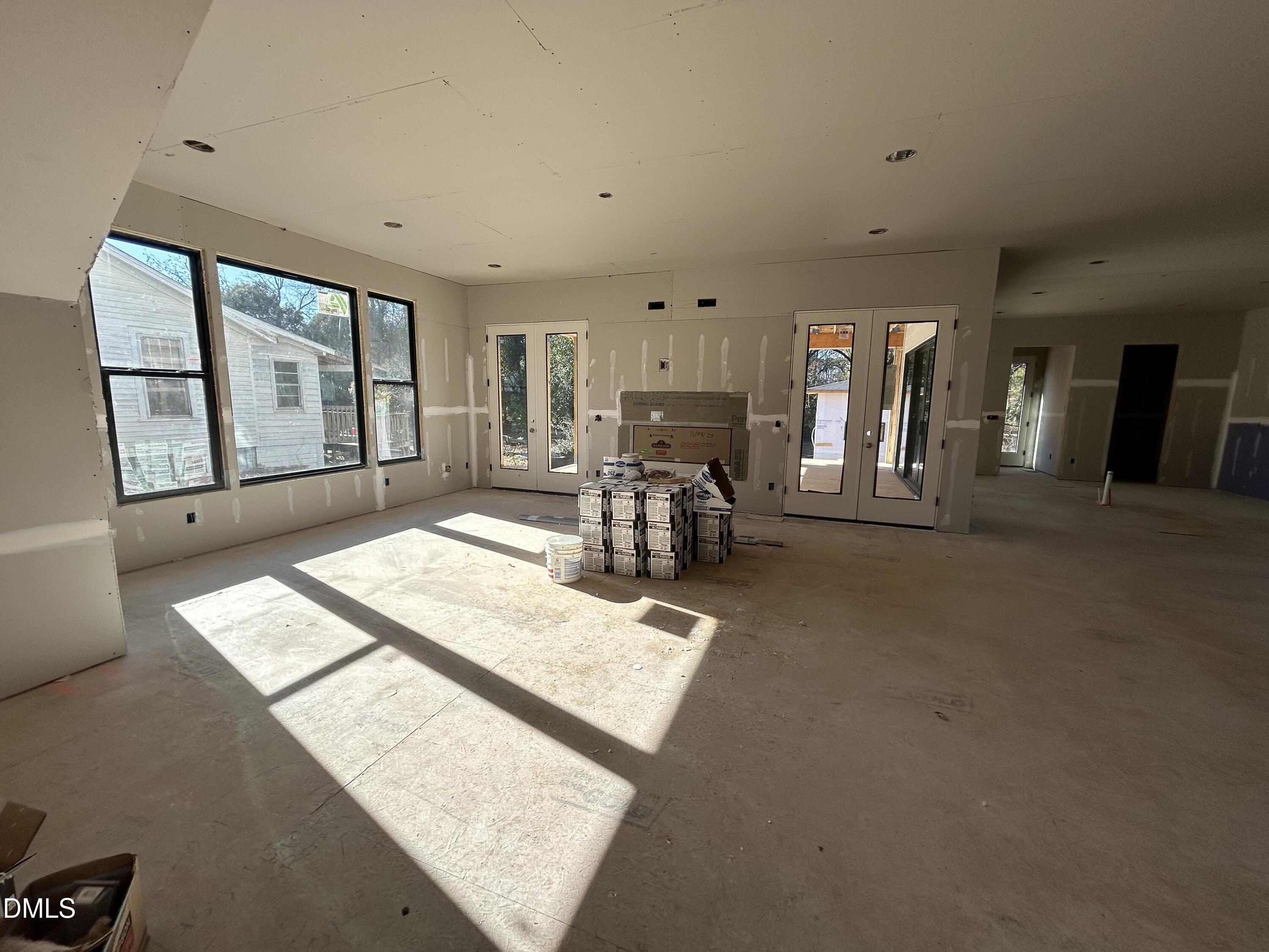 909 Oberlin Road Raleigh, NC 27605 - Photo 2 of 10 a living room with furniture and large windows