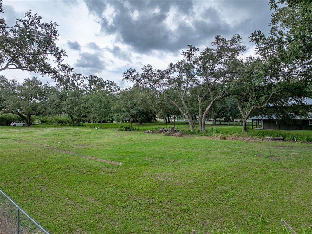 Old Berkley Road Auburndale, FL 33823 - Photo 11 of 13 a view of grassy field with benches