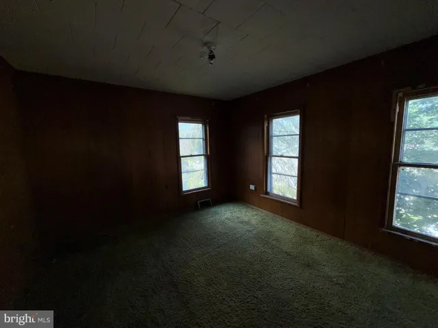 a view of empty room with windows