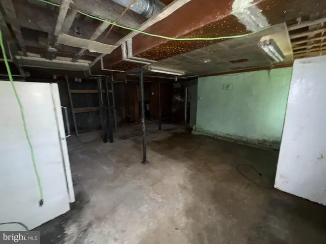 a view of room with wooden floor