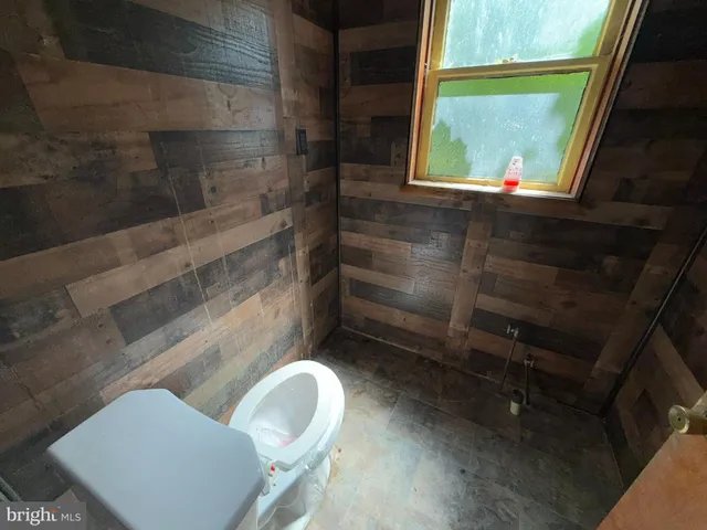 a bathroom with a toilet and a sink