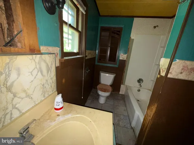 a bathroom with a sink and toilet