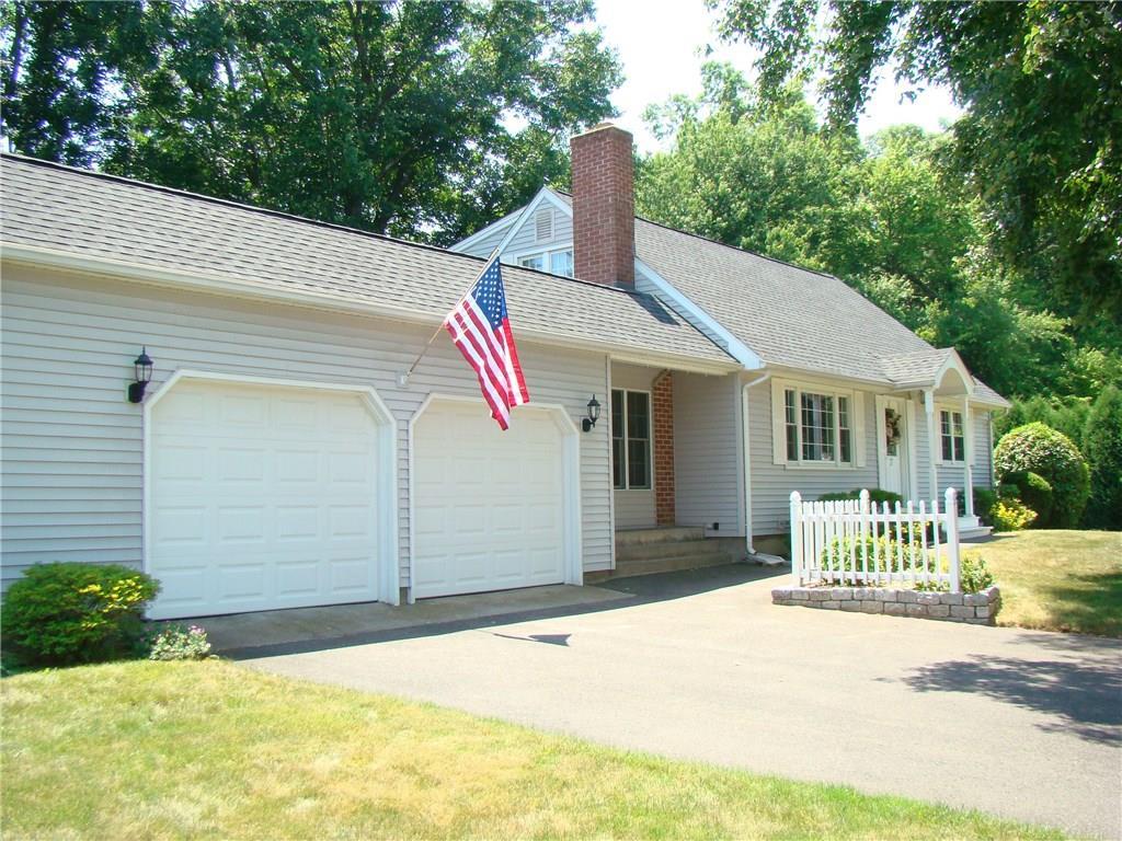 17 Armstrong Road Enfield, CT 06082 - Photo 1 of 1 a front view of a house with a garden and yard