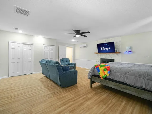 a utility room with dryer and cars
