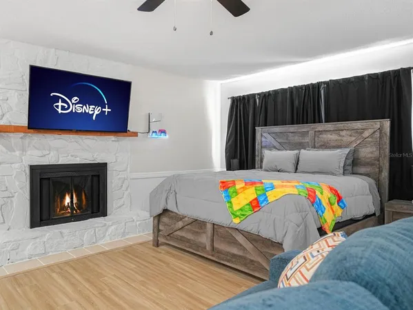 a spacious bathroom with a toilet a sink and a mirror