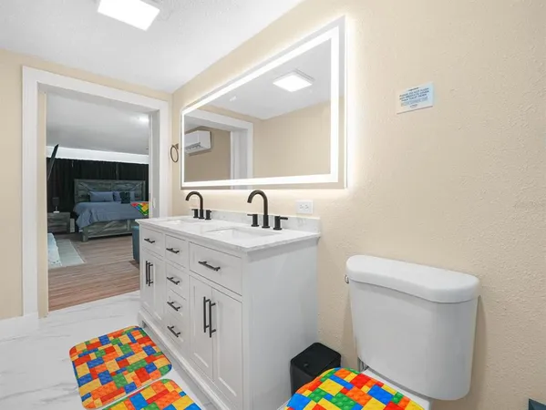 a bedroom with a bed and a ceiling fan