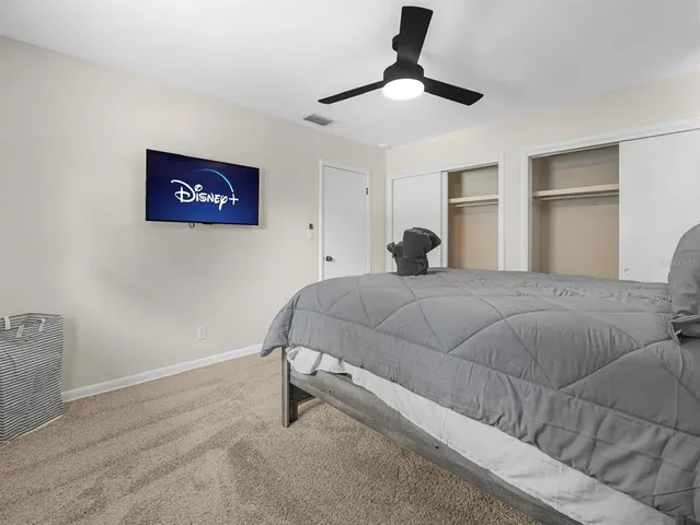 a view of a chairs and table in the back yard of the house
