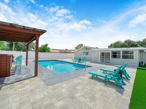 a view of a house with backyard and garden