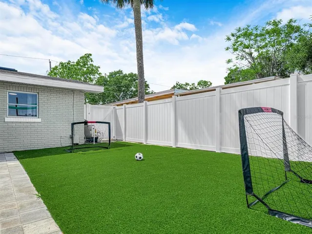a room that has a lamp and a table in it
