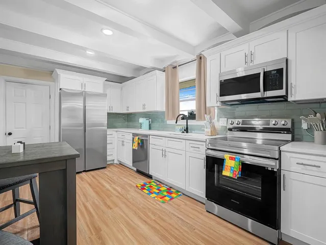 an aerial view of a house with a garden