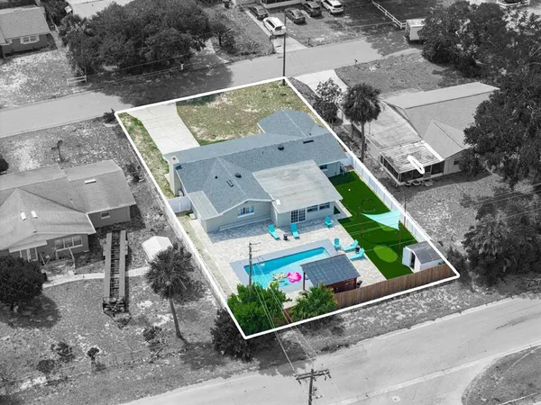 an aerial view of house with a swimming pool