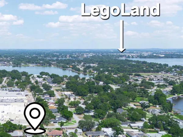 a bedroom with a large bed and a large window