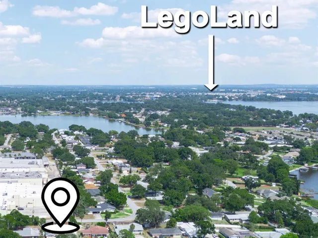 a bedroom with a large bed and a large window