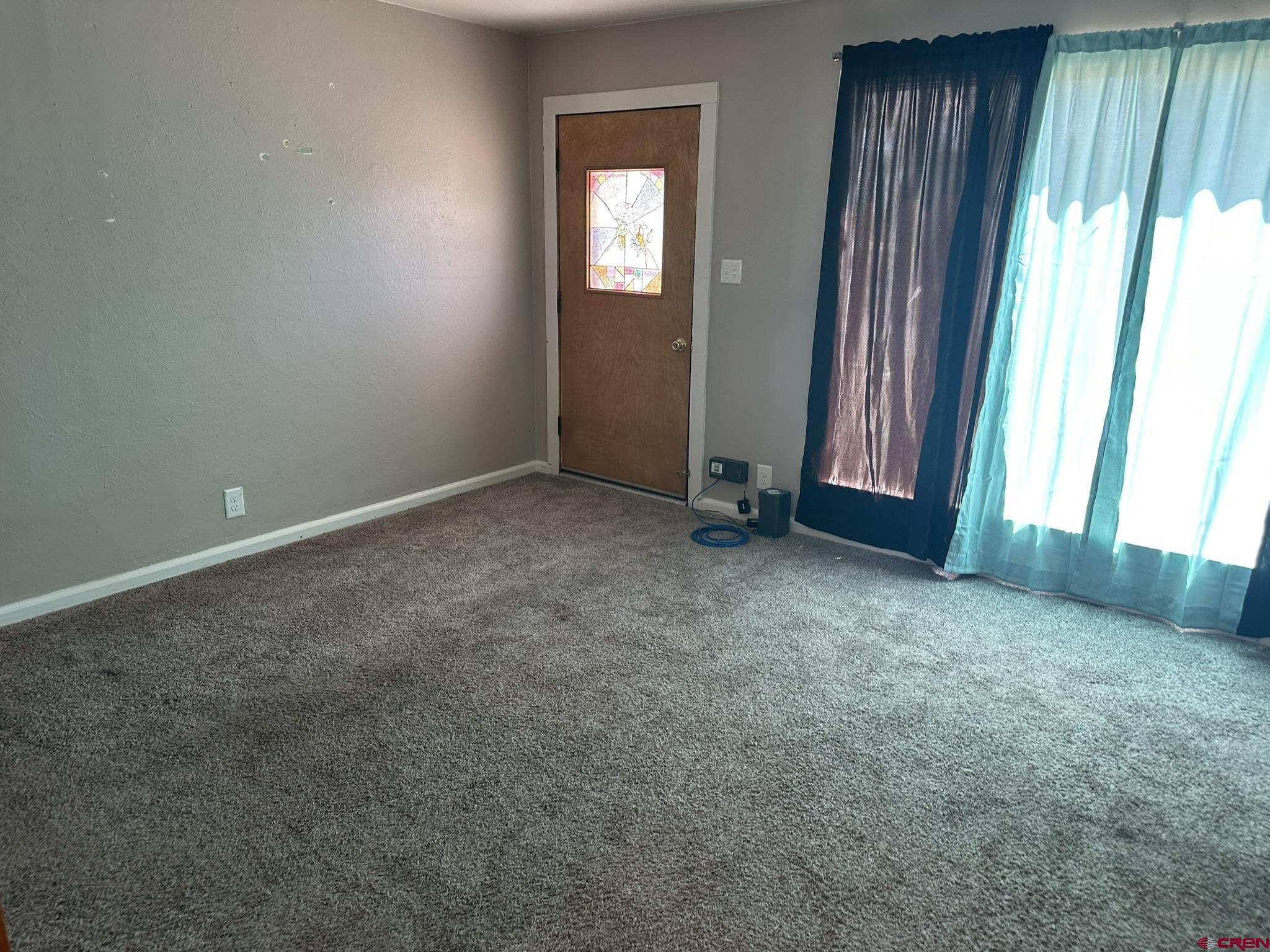 435 South Elm Street Cortez, CO 81321 - Photo 7 of 17 an empty room with windows