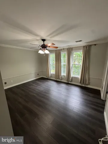 a room with pool table and a chandelier