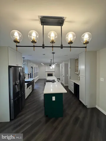 a room with pool table and a chandelier