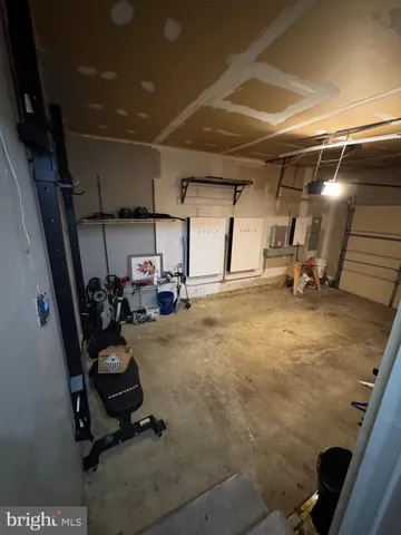 a view of a garage with parked cars