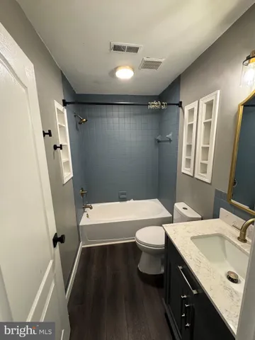 a bathroom with a tub and a shower