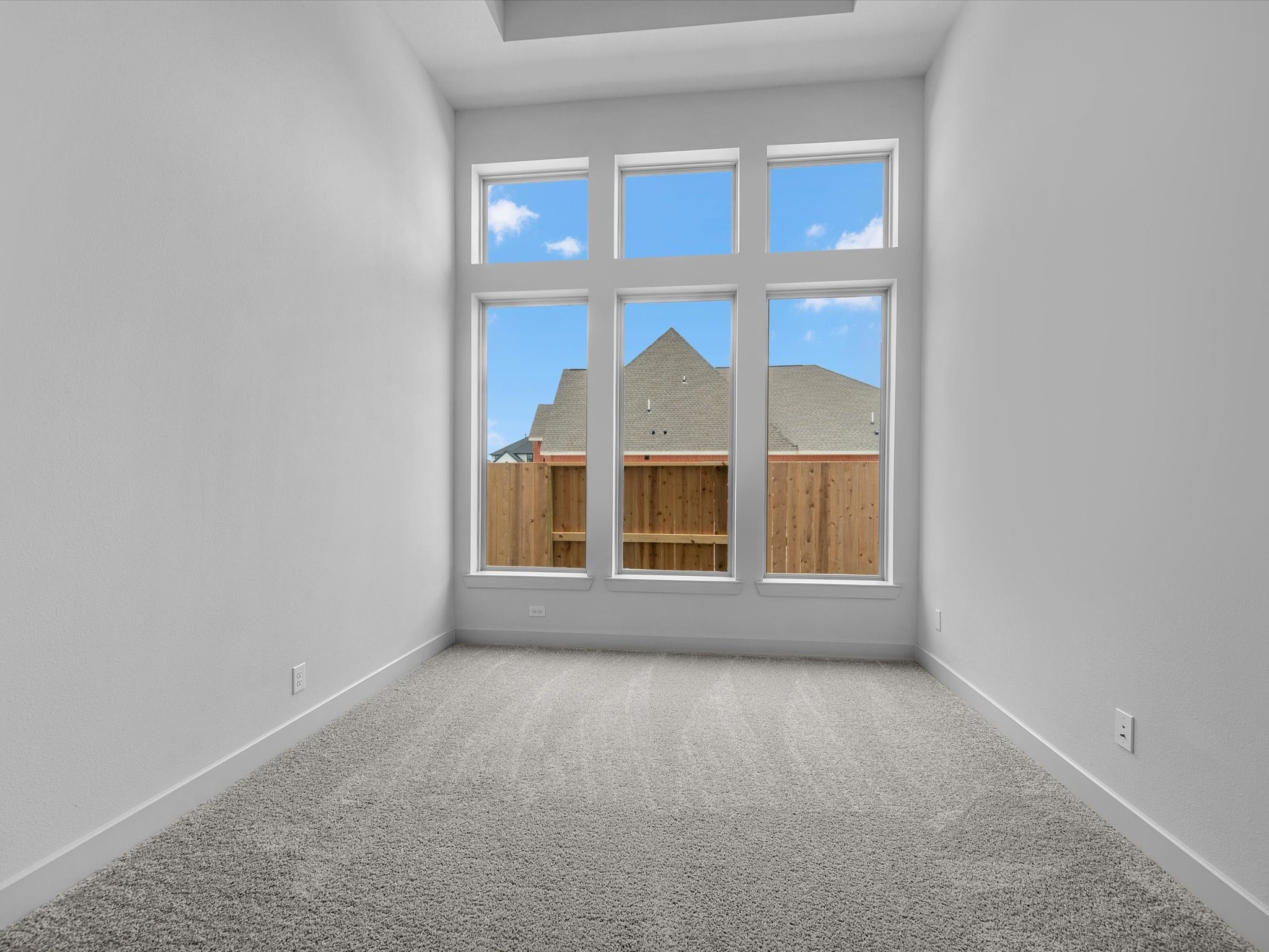 8915 Acropolis Lane Manvel, TX 77578 - Photo 12 of 32 a view of an empty room with a window