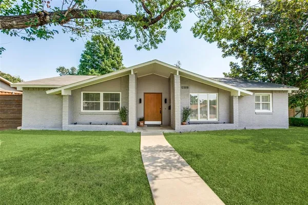 front view of a house with a yard