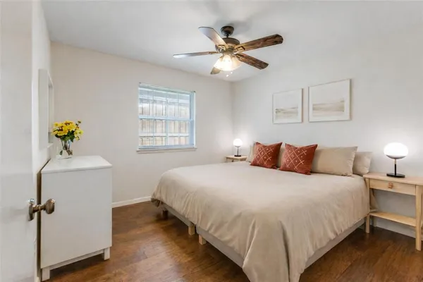 a bedroom with bed and window