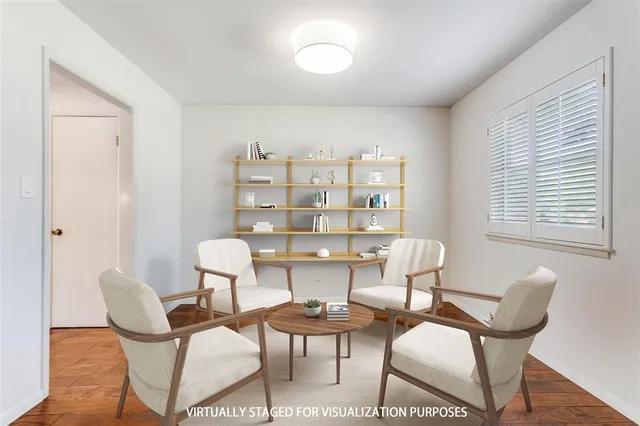 a view of a dining room with furniture and window
