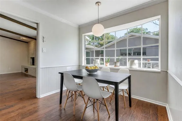 a view of a dining room and a wooden floor