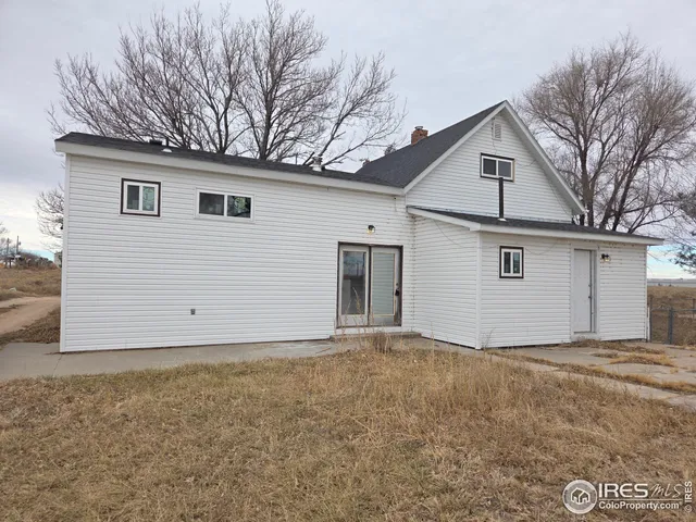 a view of garage and white house