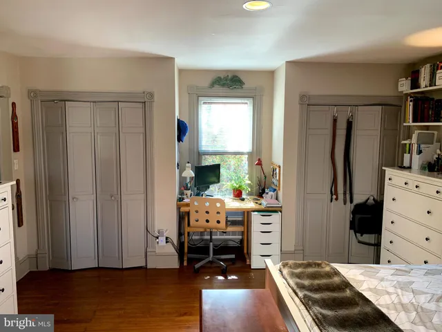 a bedroom with a bed and a closet