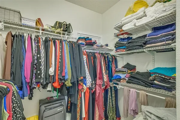 a kitchen with a sink a stove and cabinets