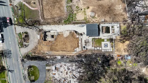 a aerial view of a house with a yard