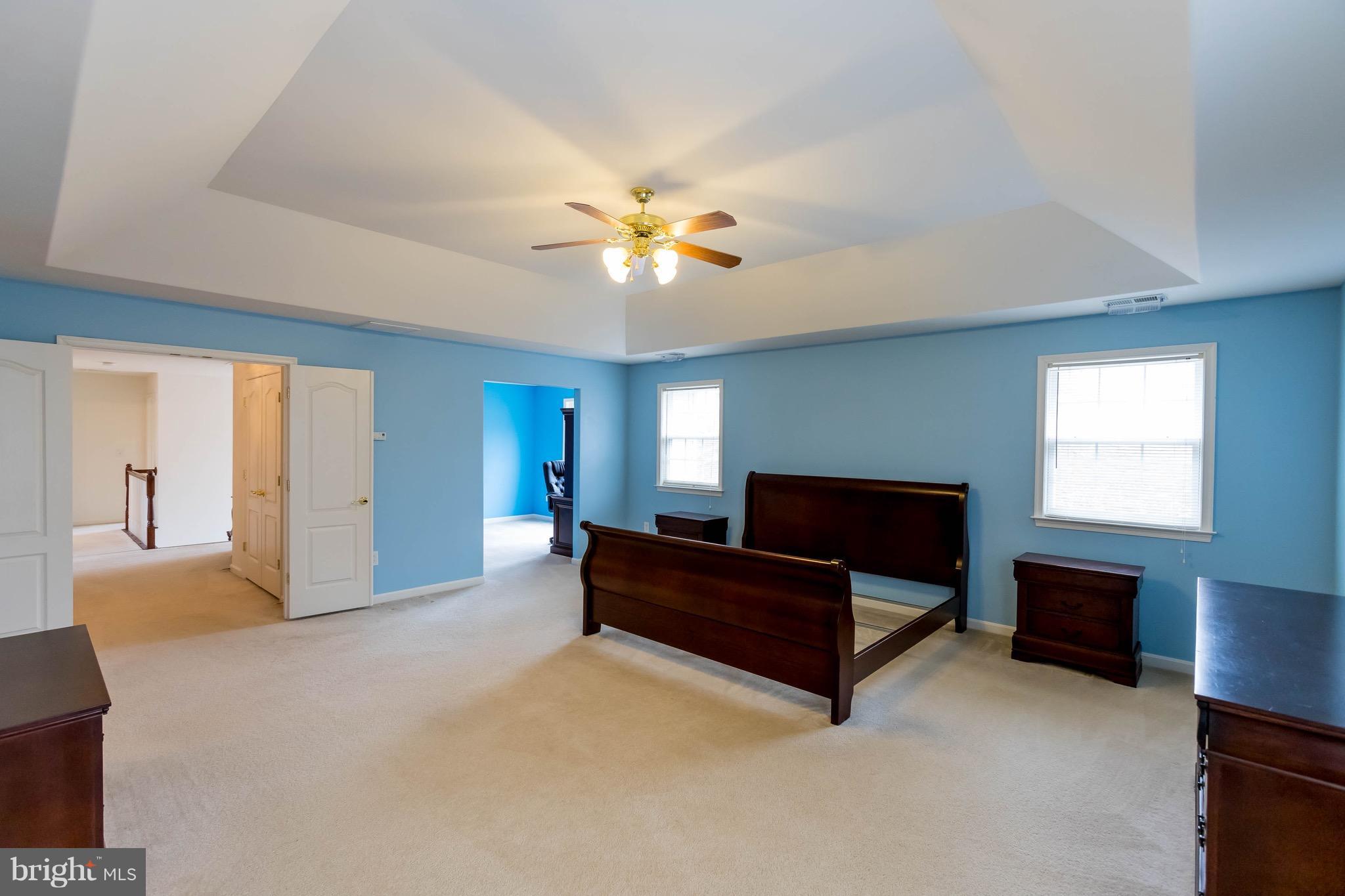 6732 North Stuart Road King George, VA 22485 - Photo 16 of 30 a living room with furniture and a chandelier