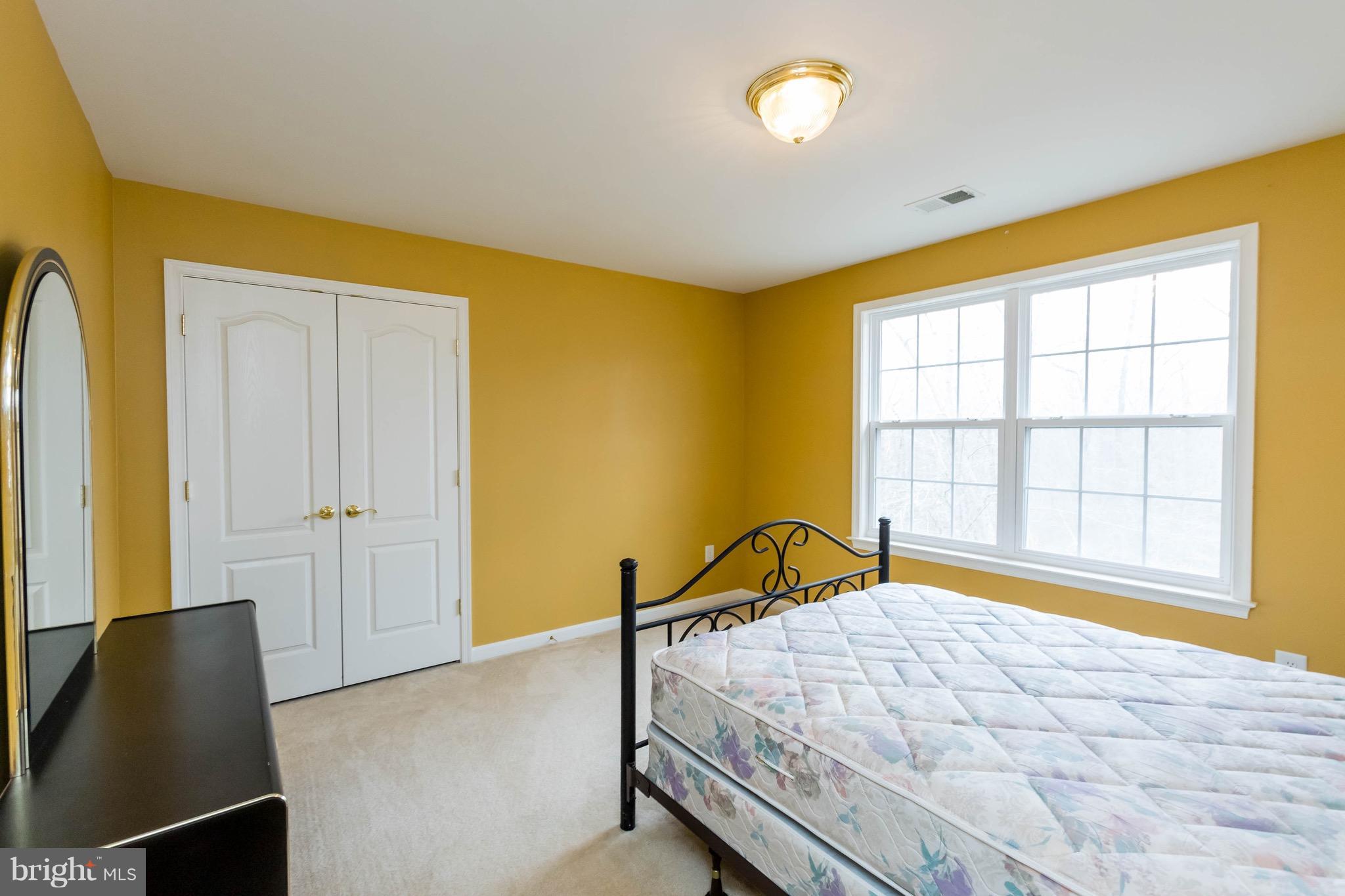 6732 North Stuart Road King George, VA 22485 - Photo 21 of 30 a bedroom with a bed and a window