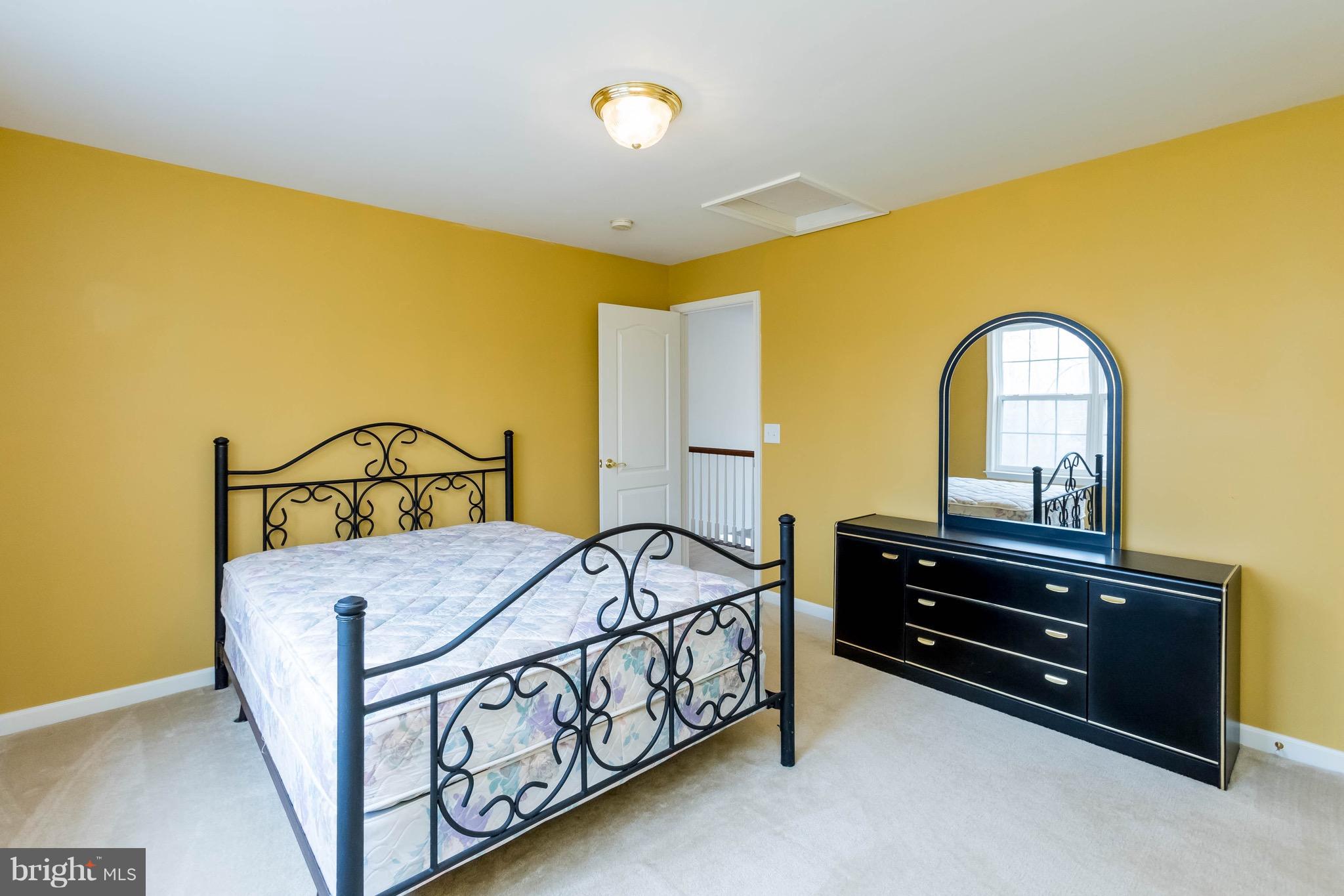 6732 North Stuart Road King George, VA 22485 - Photo 22 of 30 a bedroom with a bed and a dresser