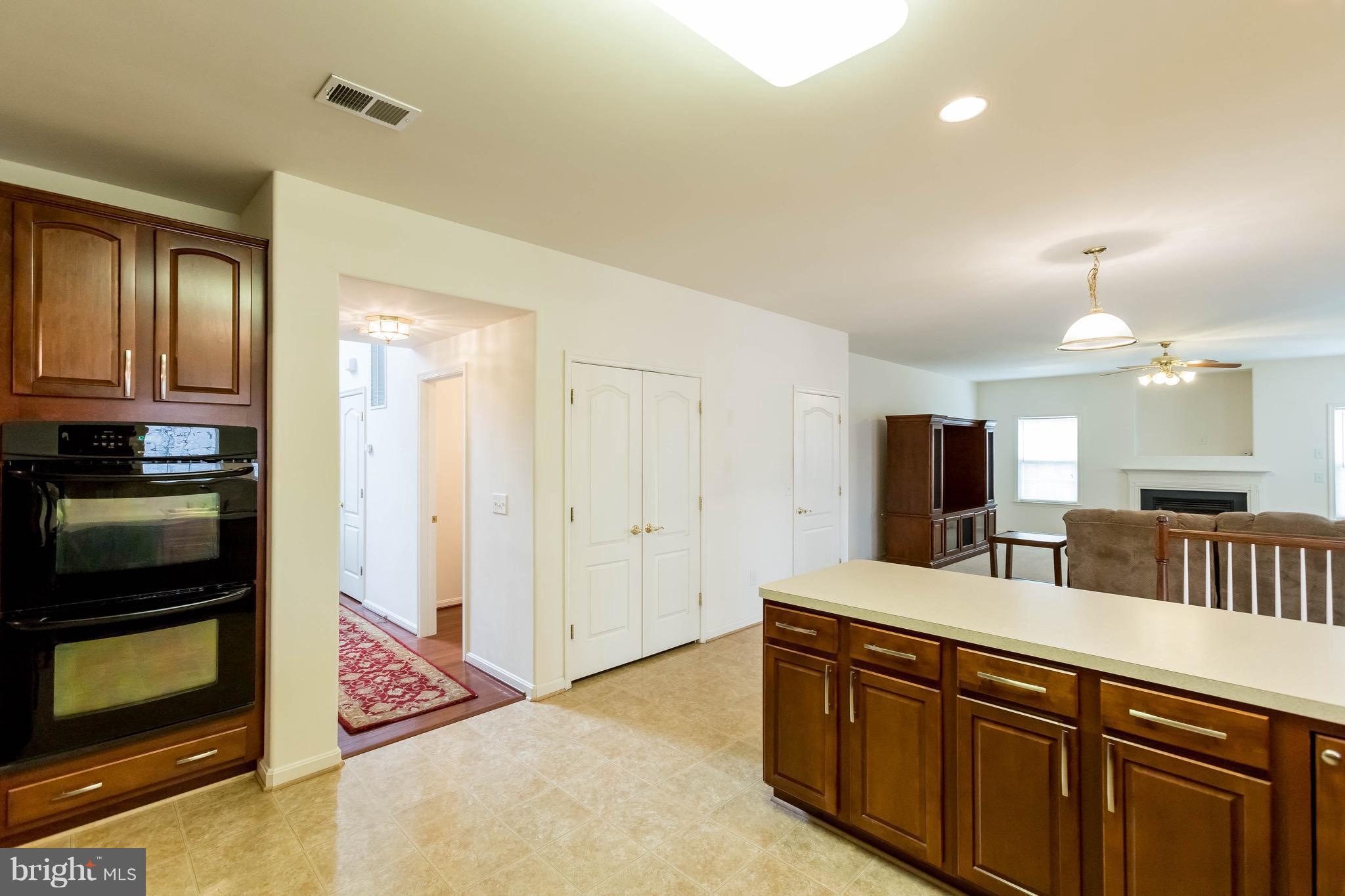 6732 North Stuart Road King George, VA 22485 - Photo 10 of 30 a kitchen with stainless steel appliances a sink and a refrigerator