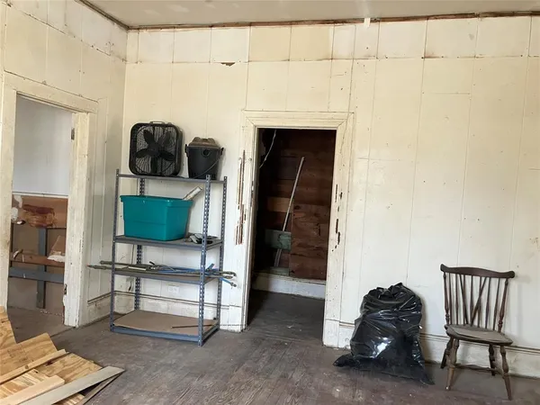 a room with a chair and a fireplace