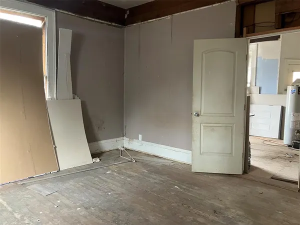 a kitchen with a refrigerator and a stove