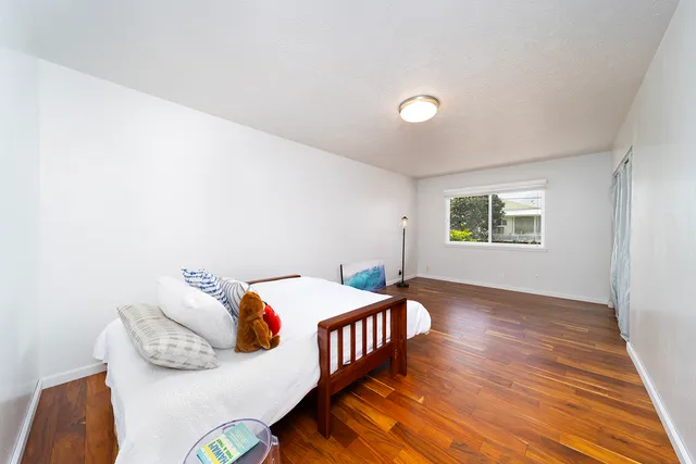 a bedroom with bed and a window