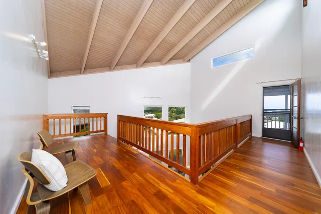 a view of a porch with wooden floor