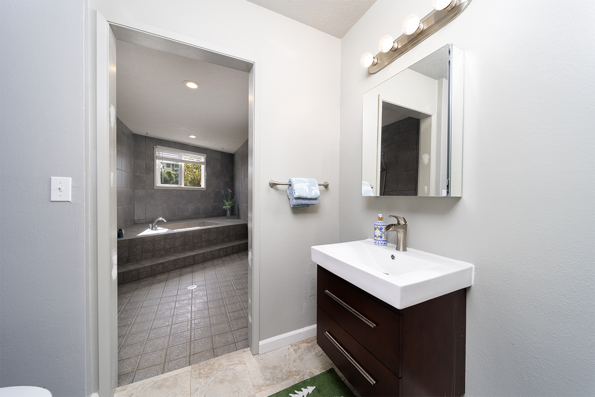 420 Huali Place Hilo, HI 96720 - Photo 19 of 30 a en suite bathroom with a sink and mirror