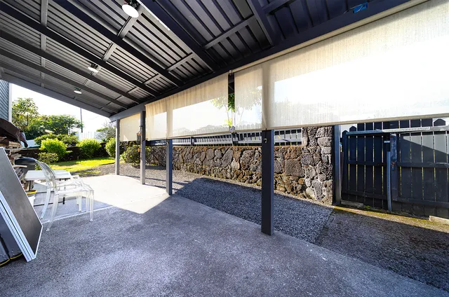 a view of a balcony with chairs