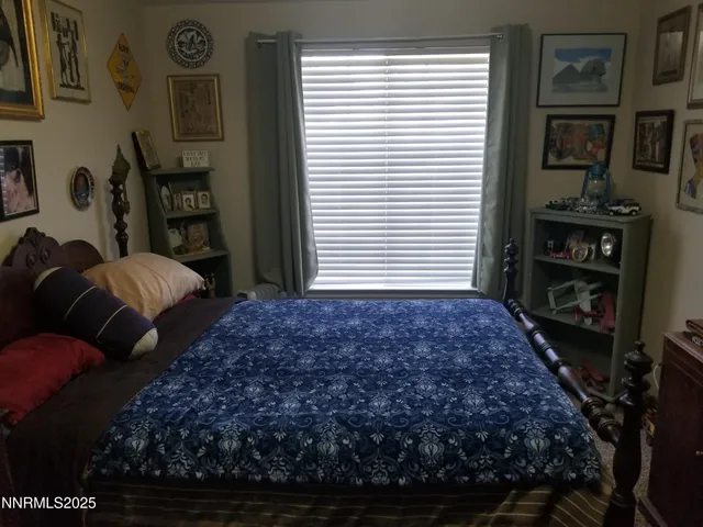 a bedroom with bed and balcony
