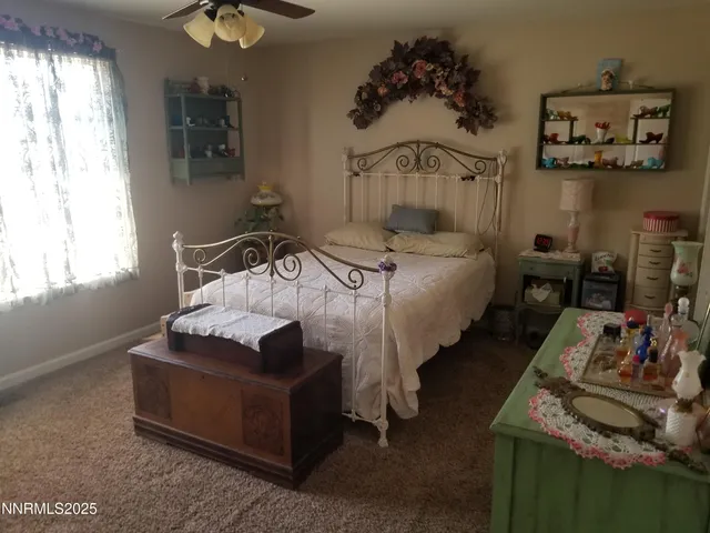 a bedroom with bed and window