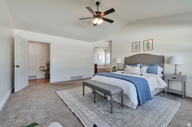 1288 North Horizon View Loop Elk Ridge, UT 84651 - Photo 17 of 40 Carpeted bedroom featuring ceiling fan, lofted ceiling, and ensuite bathroom