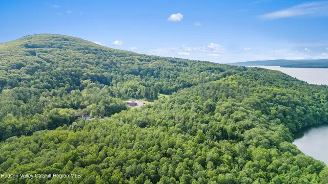 a view of a big yard with lots of green space
