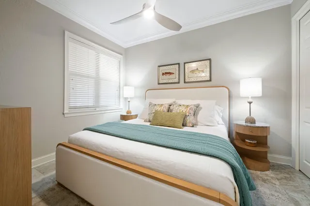 a bedroom with a bed and a night stand