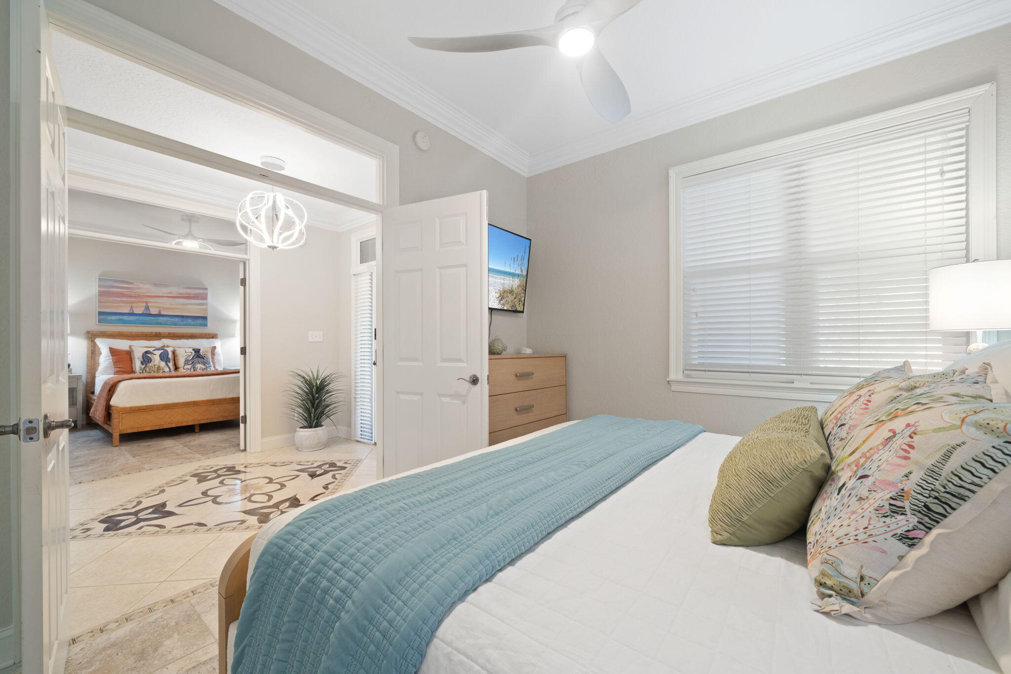 602 Harbor Boulevard, Unit 103 Destin, FL 32541 - Photo 13 of 47 a bedroom with a large bed and a window