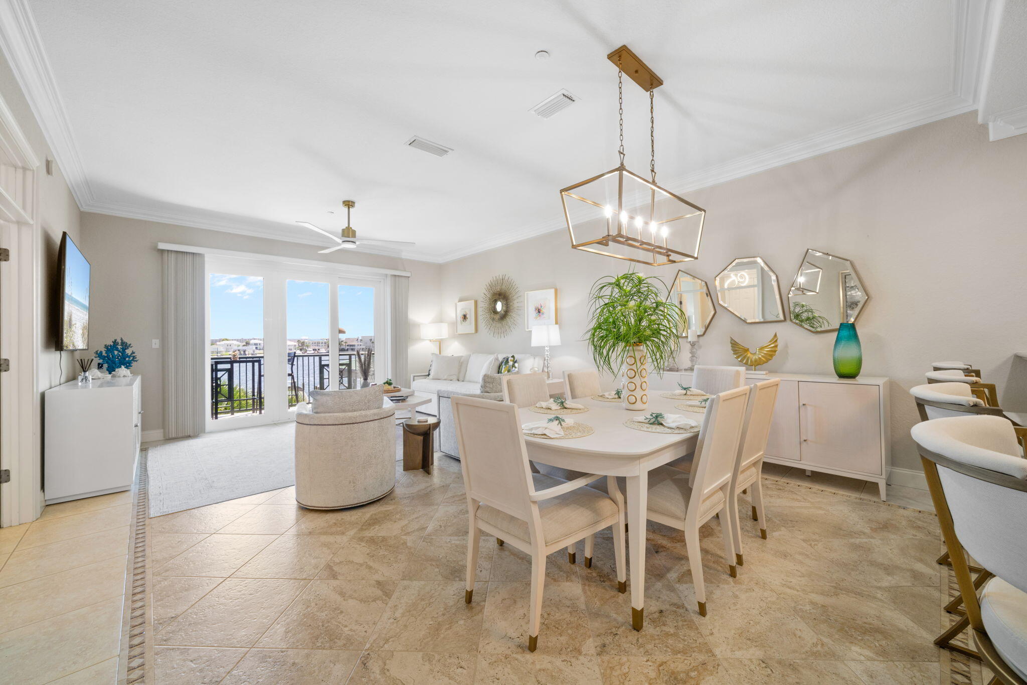 602 Harbor Boulevard, Unit 103 Destin, FL 32541 - Photo 20 of 47 a view of a dining room and livingroom with furniture wooden floor a chandelier