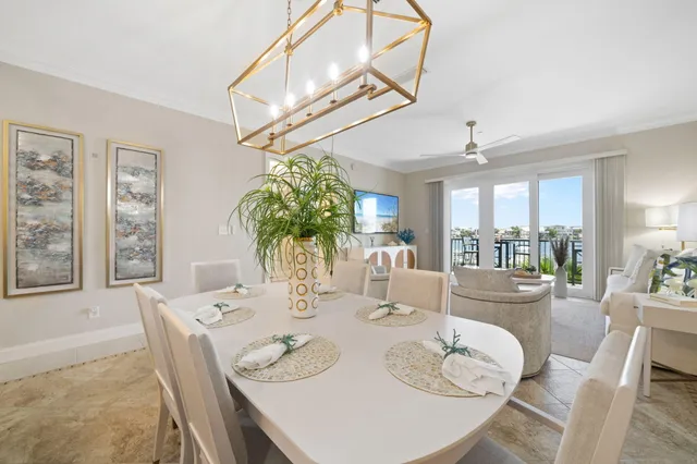 a dining room with furniture a livingroom and chandelier